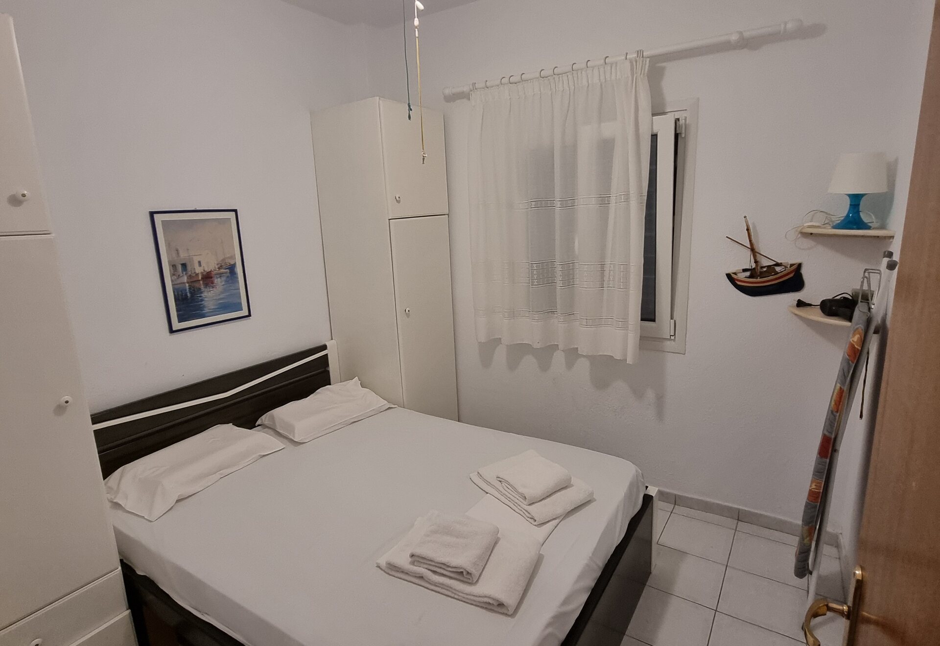 Polychrono Duplex queen bedroom with prepared bed and towels