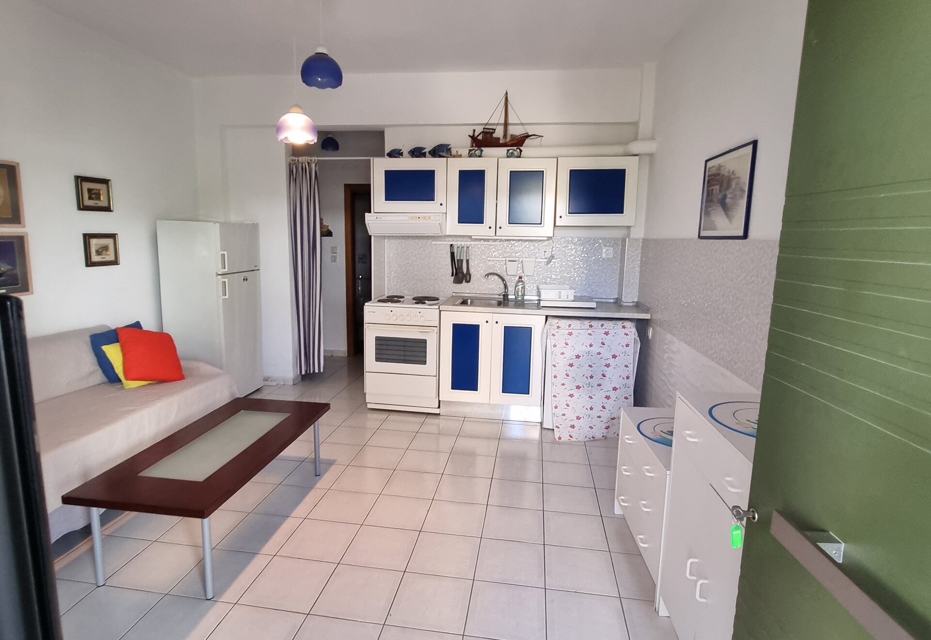 Polychrono Duplex open living room and private kitchen