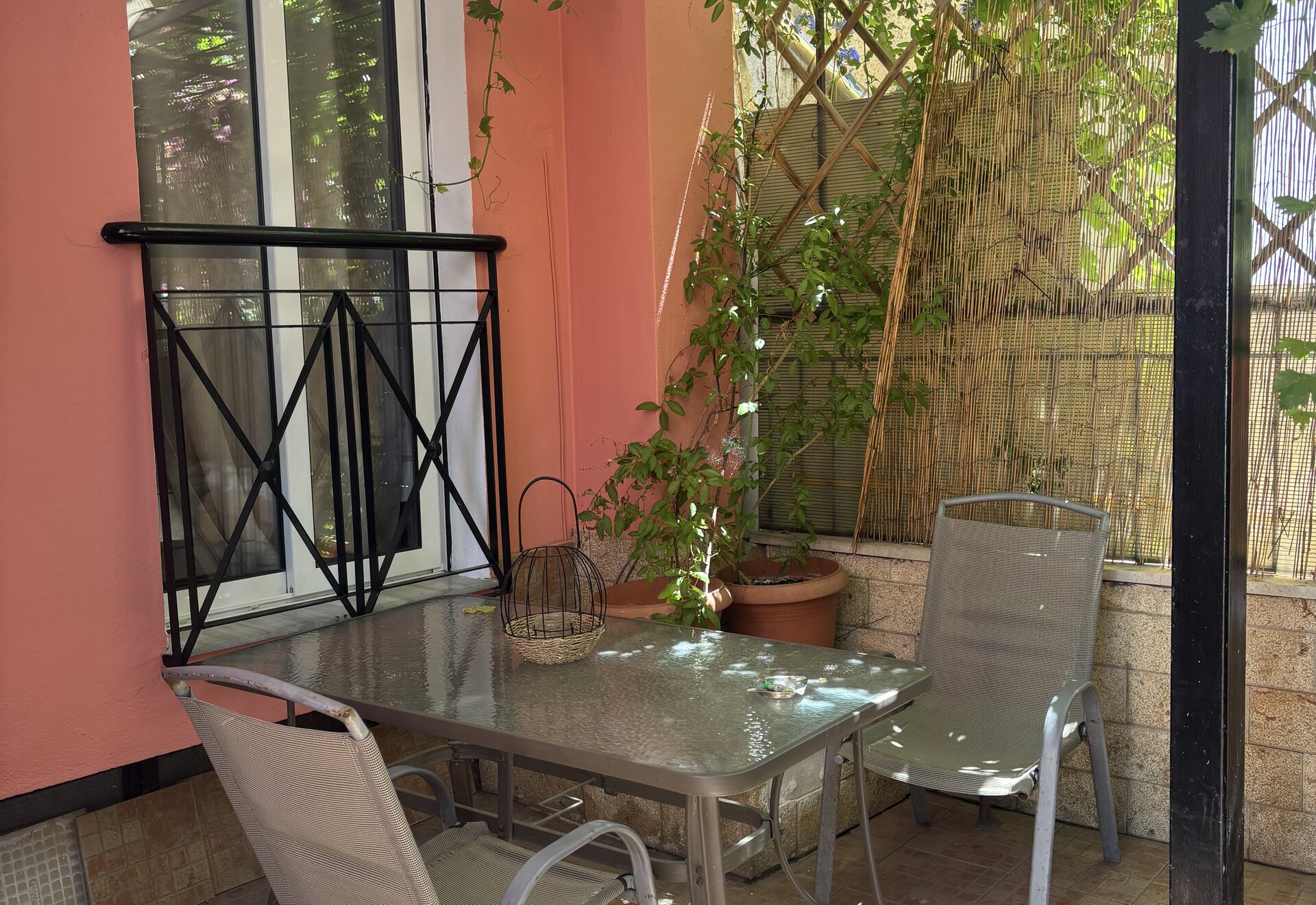 Polychrono Patio Retreat private patio with outdoor dining table and chairs