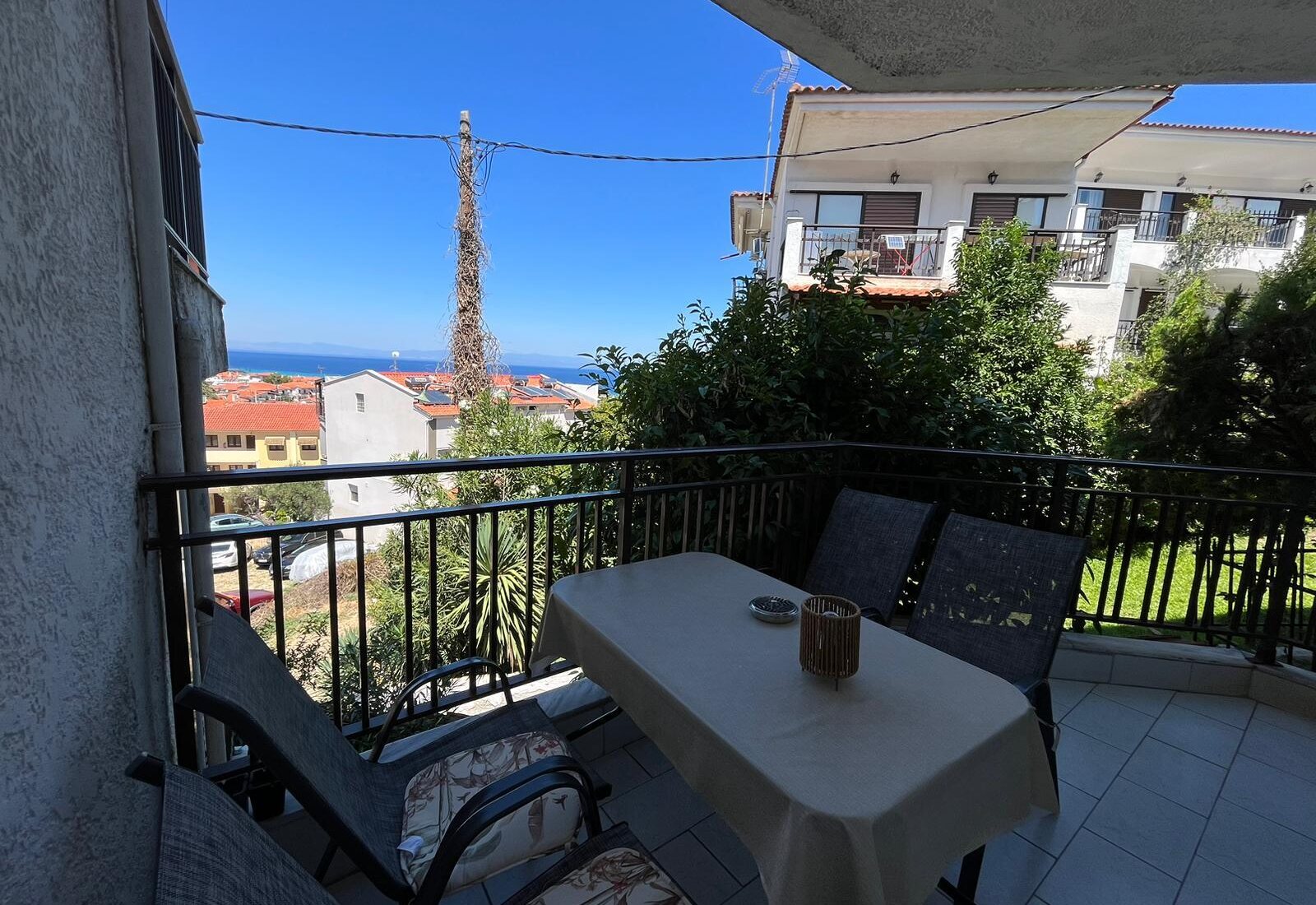 Aegean Dream balcony with outdoor dining and sea view