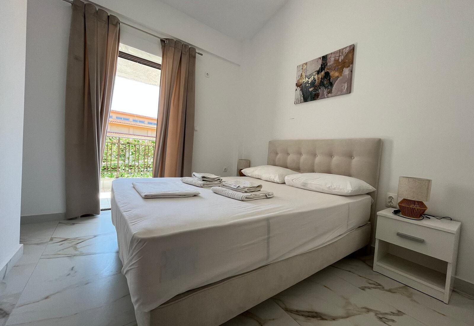 Aegean Dream bedroom with double bed and balcony doors