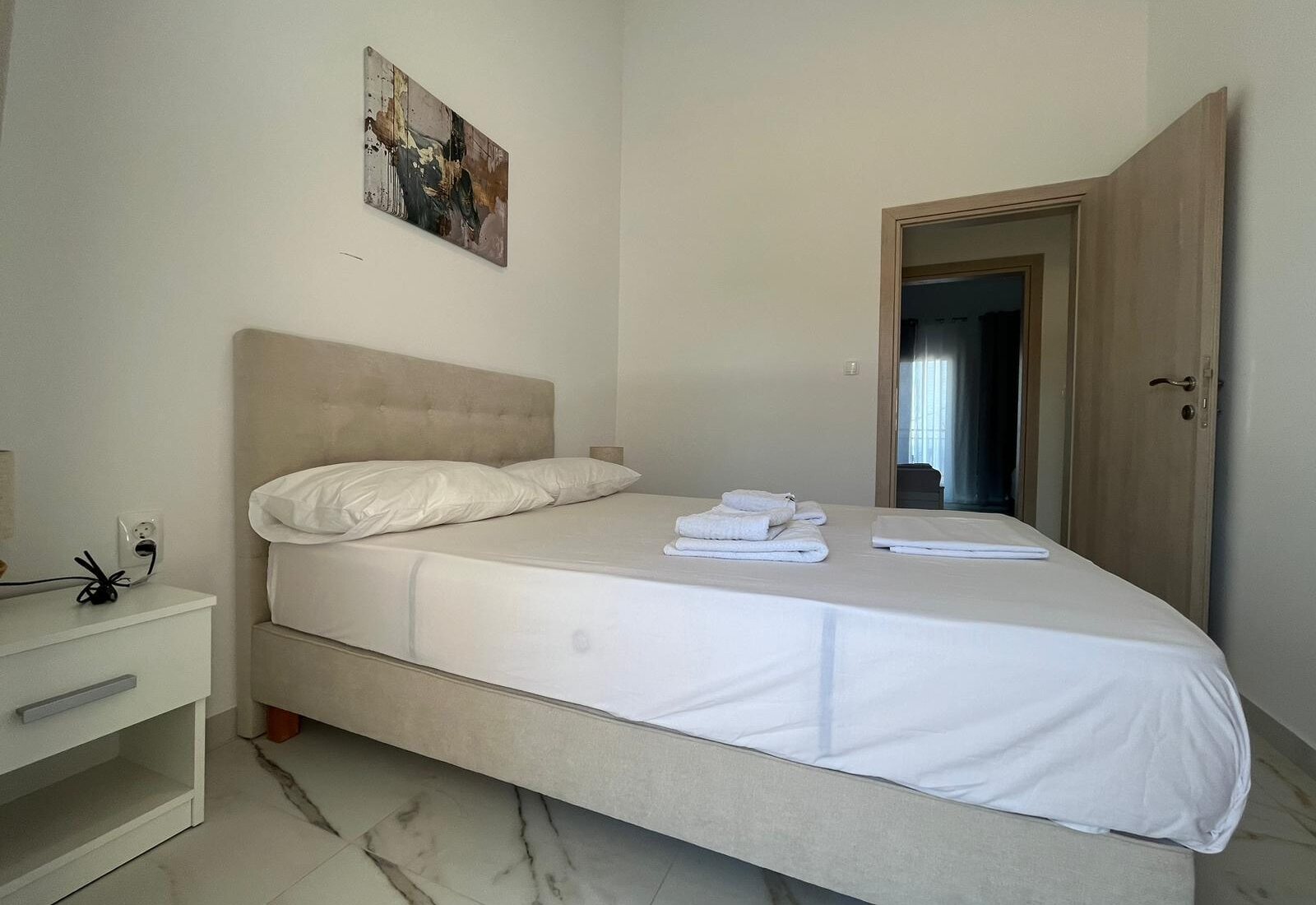 Aegean Dream bedroom with double bed and towels