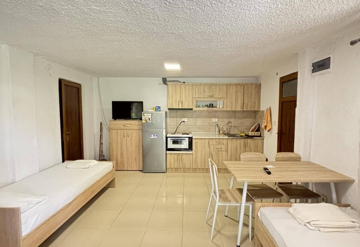 Garden Haven Apartment with Garden View open-plan kitchen with twin beds