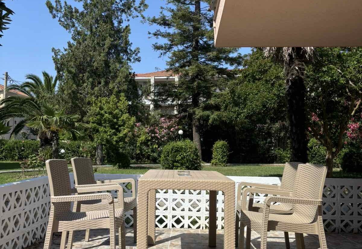 Garden Haven Apartment with Garden View terrace dining table overlooking the garden