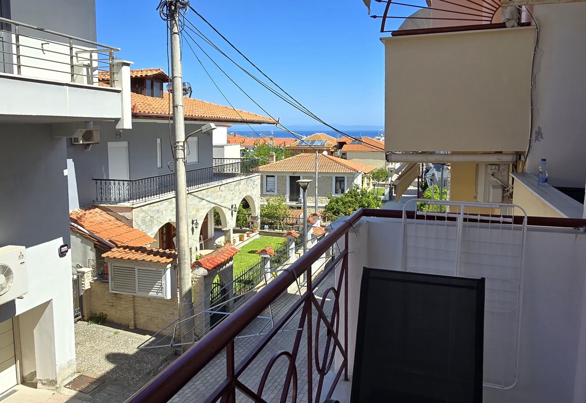 Polychrono Two Bedroom Apartment balcony seating with sea view over Polychrono